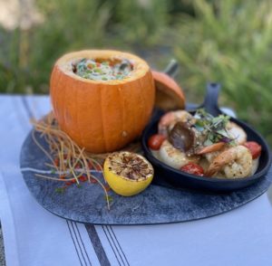 pumpkin ricotta gnocchi accompanied by shrimp and scallops with meyer lemon garlic butter