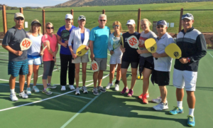 View of Red Ledges Club members holding paddle ball paddles