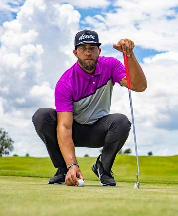 Tarek DeLavallade lining up a putt