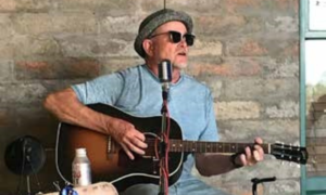 Brian Curley playing guitar